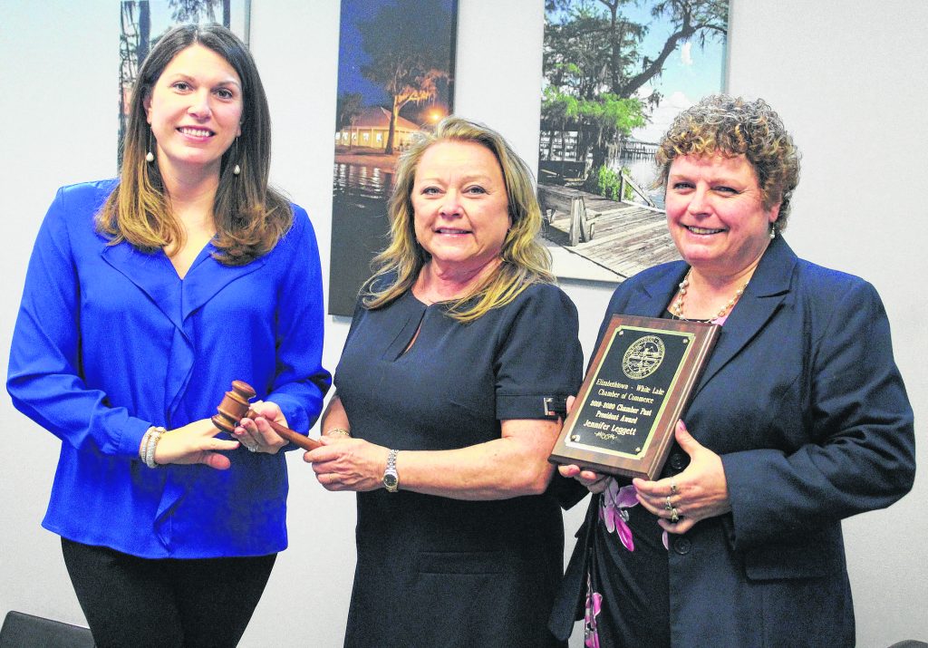 Jennifer Leggett was presented a plaque for serving as the 2019-2020 Chamber President. She is seen here hanfing the President gavel to Anne Beyers.