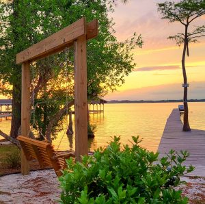 white lake sunset and swing